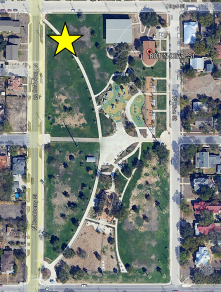 This photo shows a view of Lockwood Dignowity Park. A yellow star indicates the project site location at 801 N. Olive St, San Antonio, TX 78202.